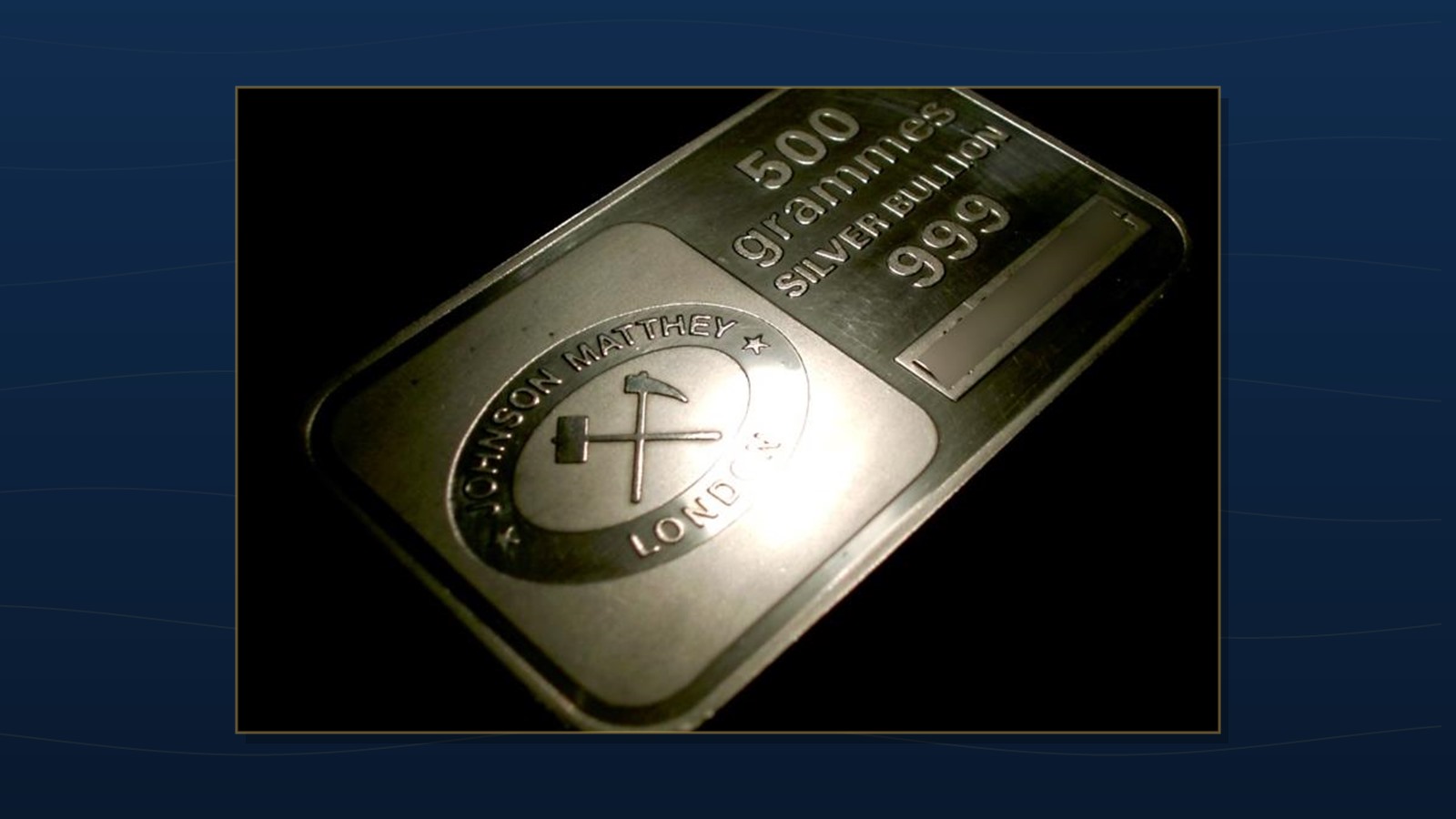 A cast silver bullion bar stamped with the maker's name, weight and fineness